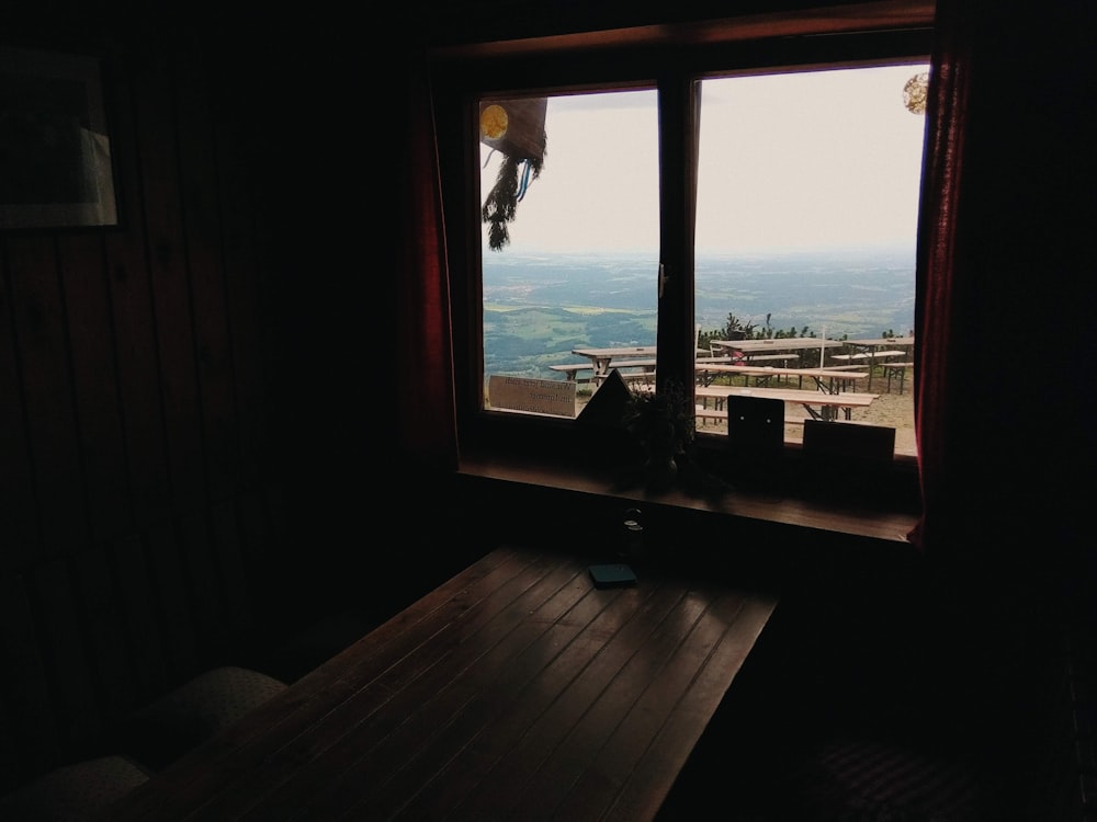 brown wooden frame glass window