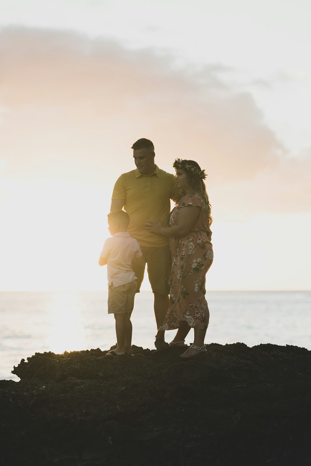 family standing on rock