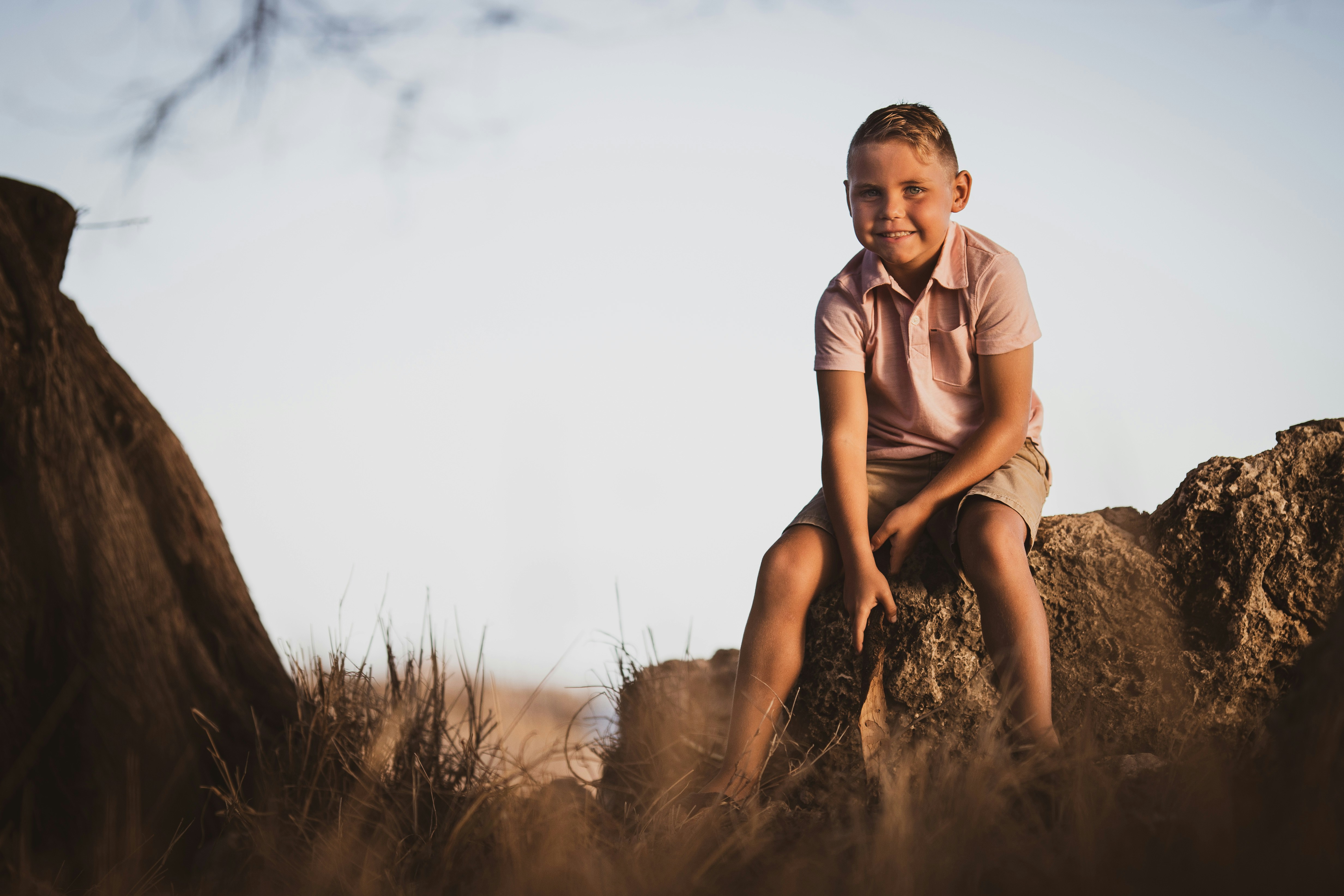 Canon EOS 6D Mark II sample photo. Boy sitting on rock photography
