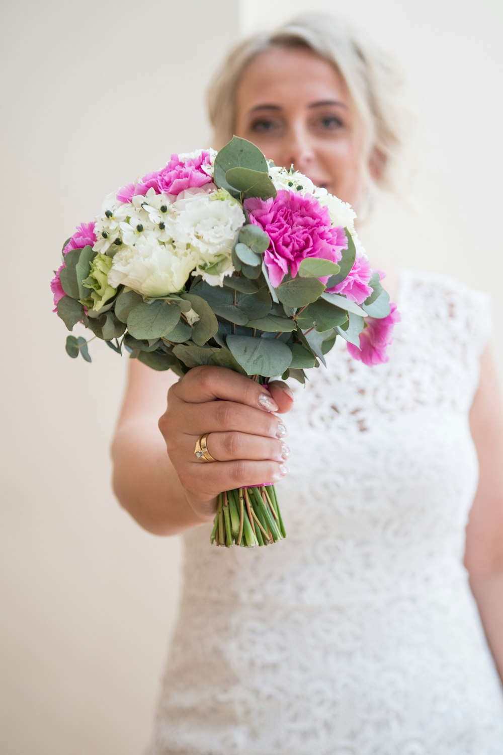 woman holding white and pink bouquet