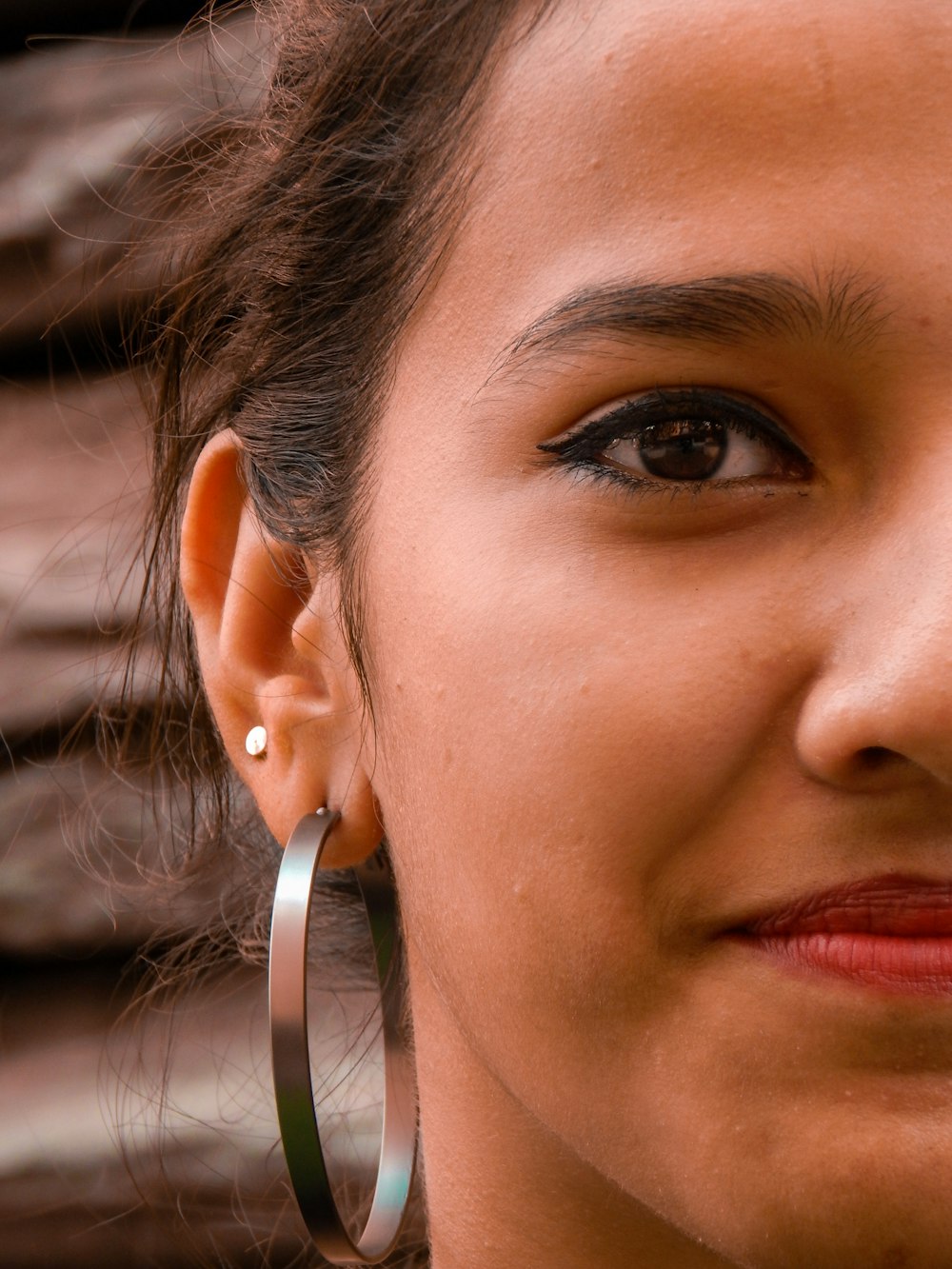 woman wears bangle earring