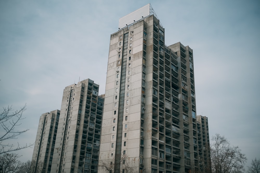 brown and gray high-rise building under white and blue skies