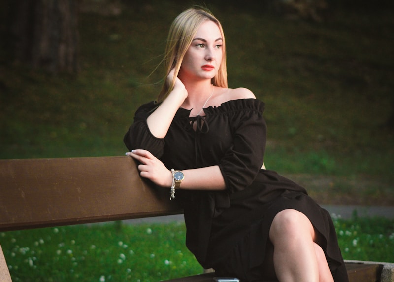 Elegant woman in off-shoulder black dress