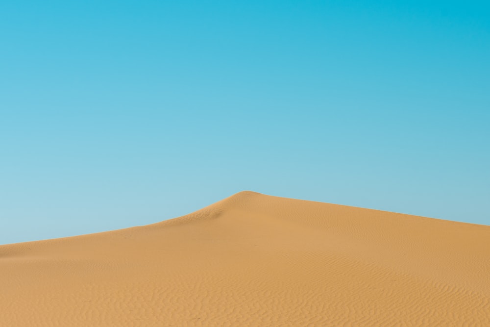 photo of brown sand dunes