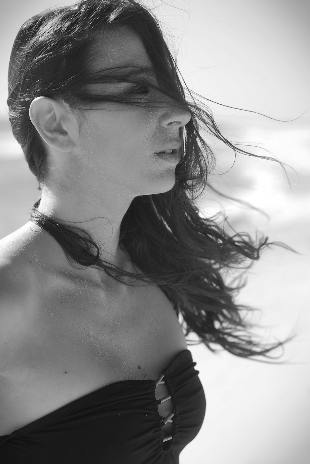 grayscale photography of woman wearing black tube top