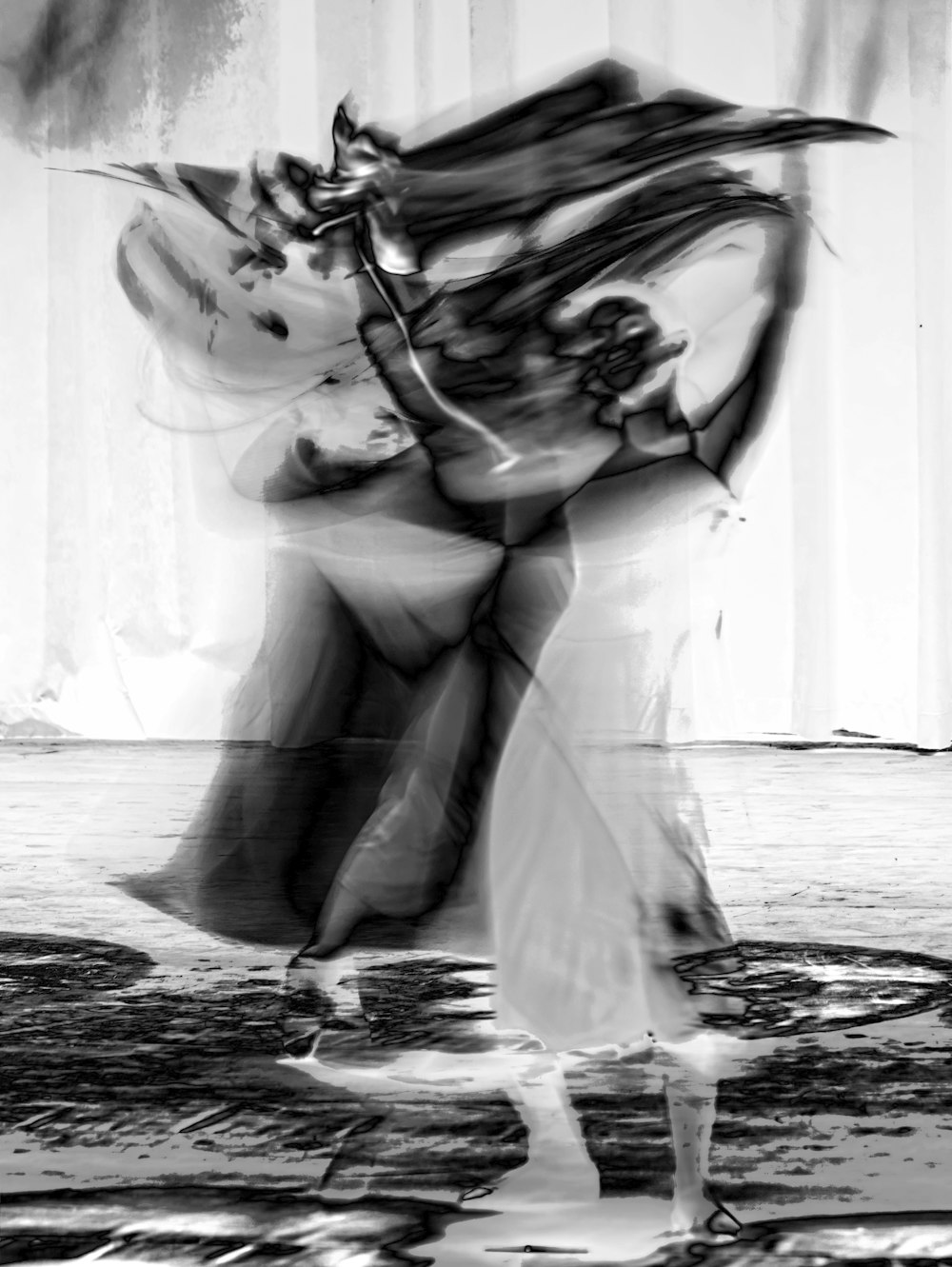 a black and white photo of a couple dancing