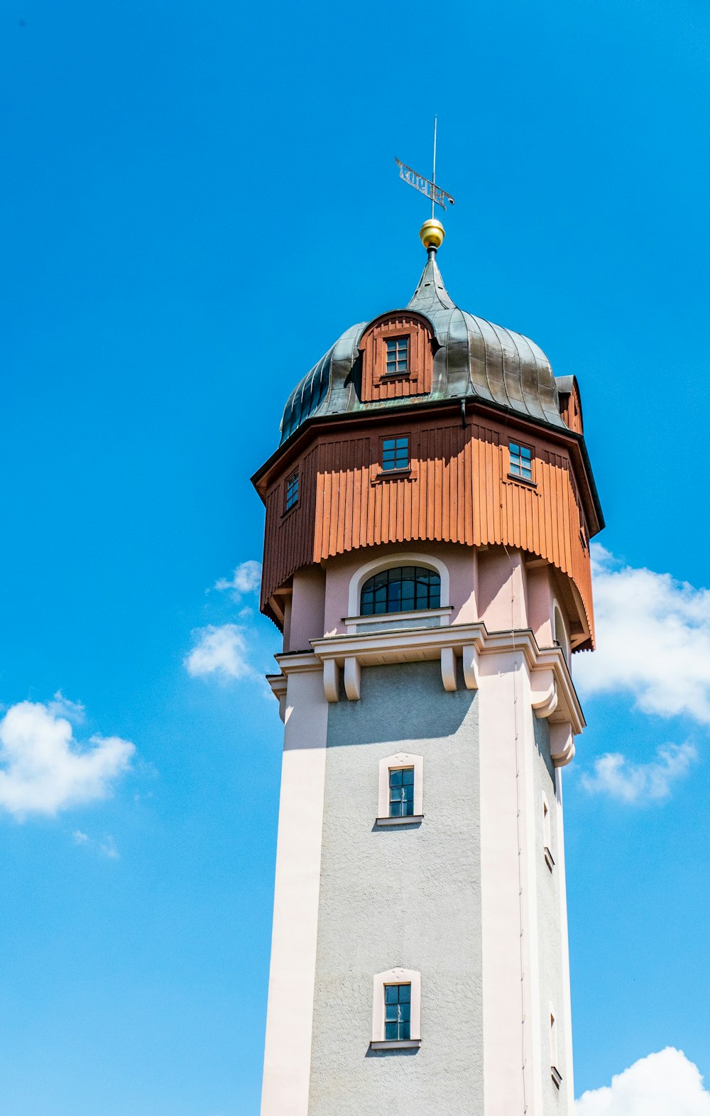 architectural photo of a white, gray and brown tower