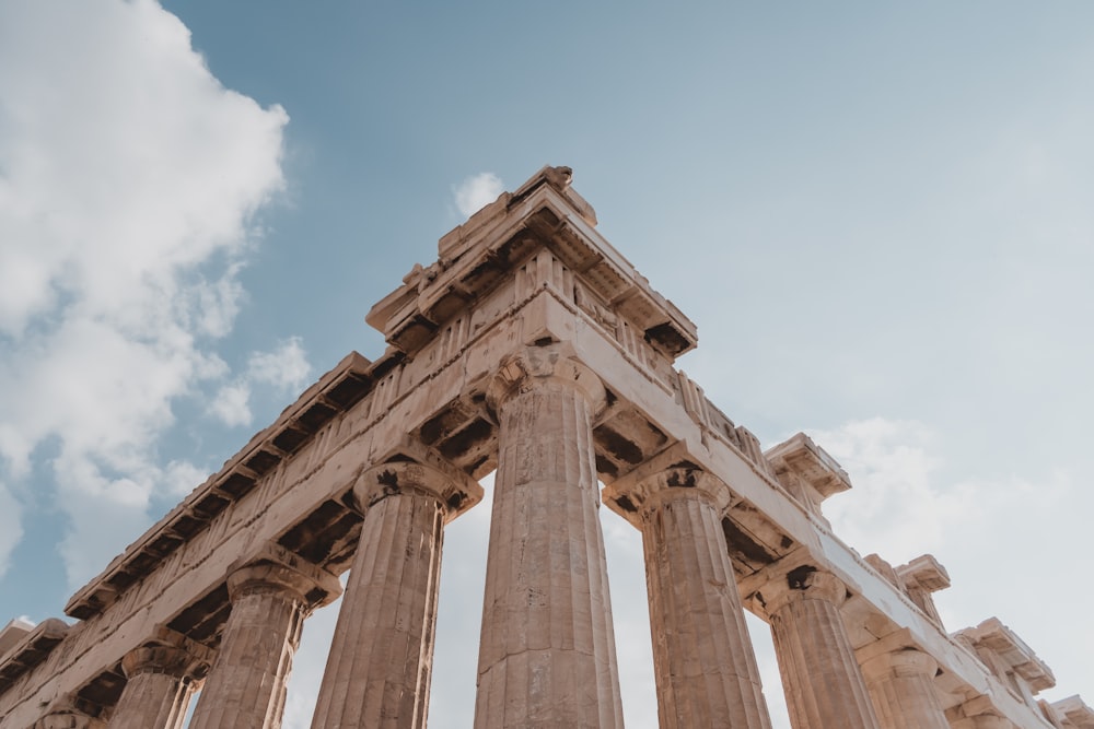 low-angle photography of column ruins during daytime