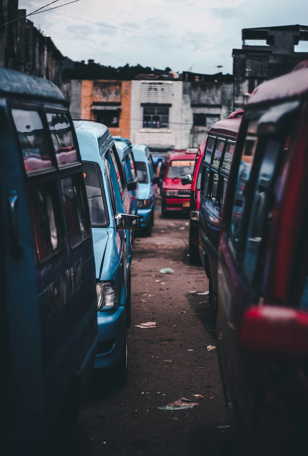 assorted vans lining up near buildings