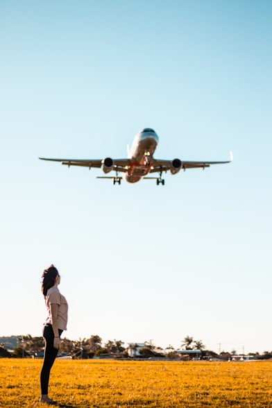 woman under airplane