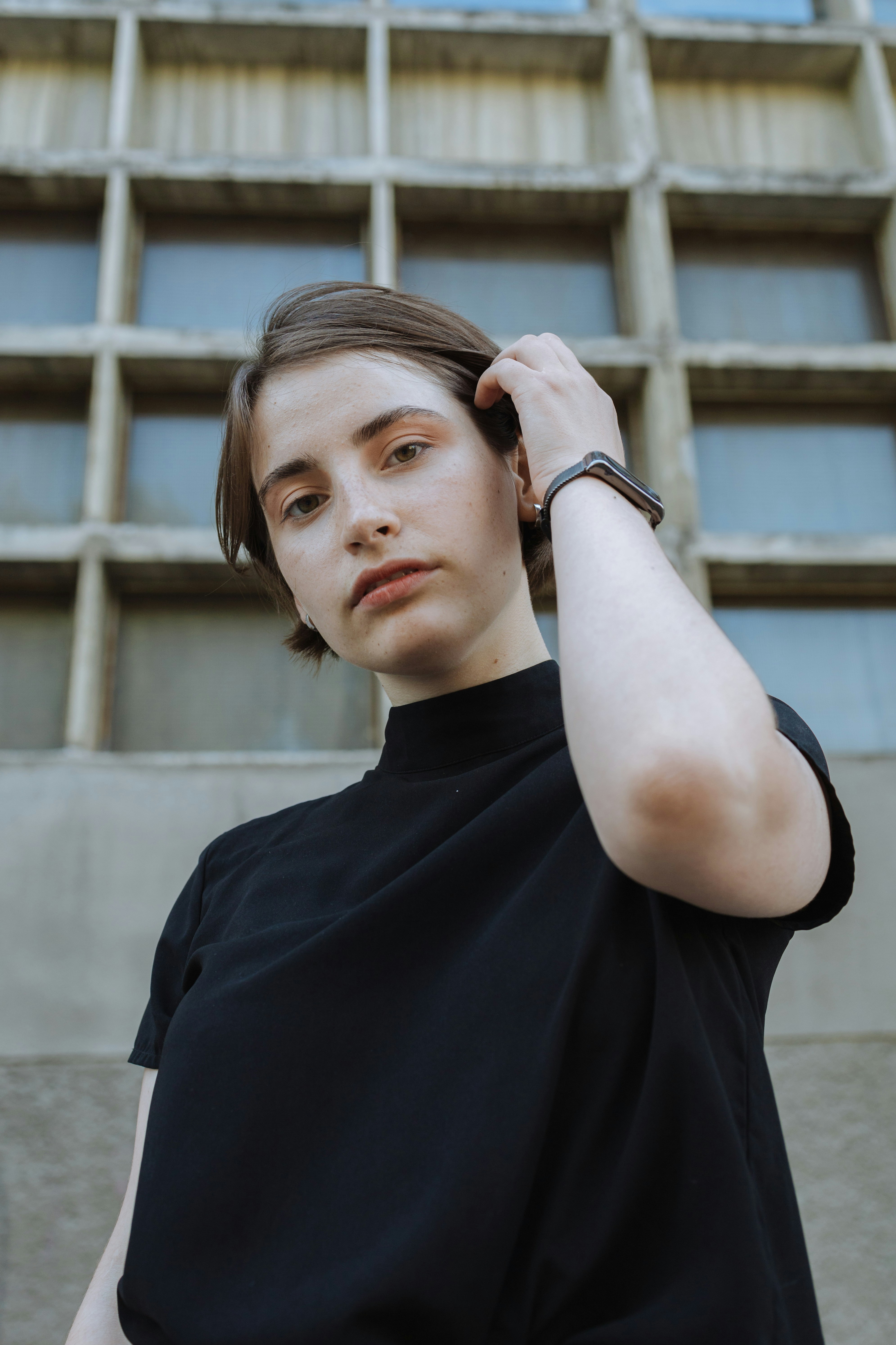 Woman Wearing Black Short Sleeved Shirt Fixing Hair Photo Free