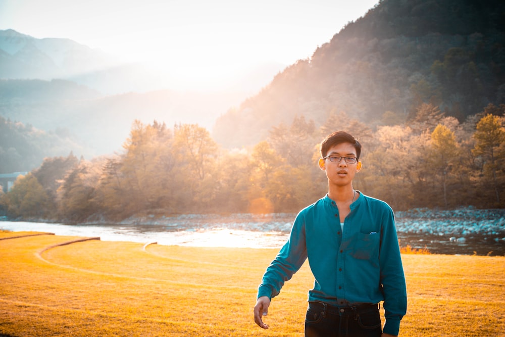 man standing near river