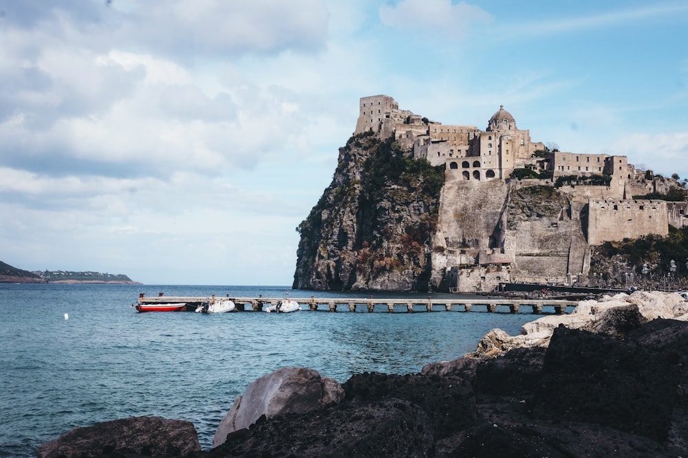 wooden dock near cliff