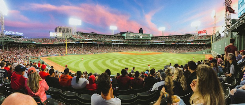 People watching a baseball game from the stands, a family night out option in Downtown Summerlin this October