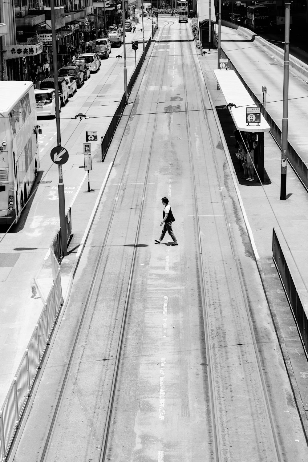 man walks across the street