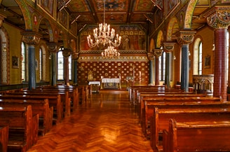 Photo of a church floor before and after refinishing, highlighting the transformation to a smooth, gleaming finish.
