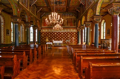 Photo of a church floor before and after refinishing, highlighting the transformation to a smooth, gleaming finish.