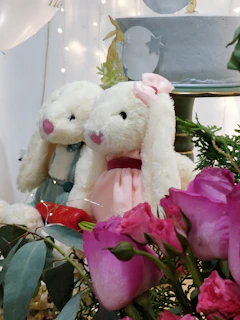 A couple celebrating their wedding with personalized plush toys.