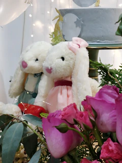 A couple celebrating their wedding with personalized plush toys.