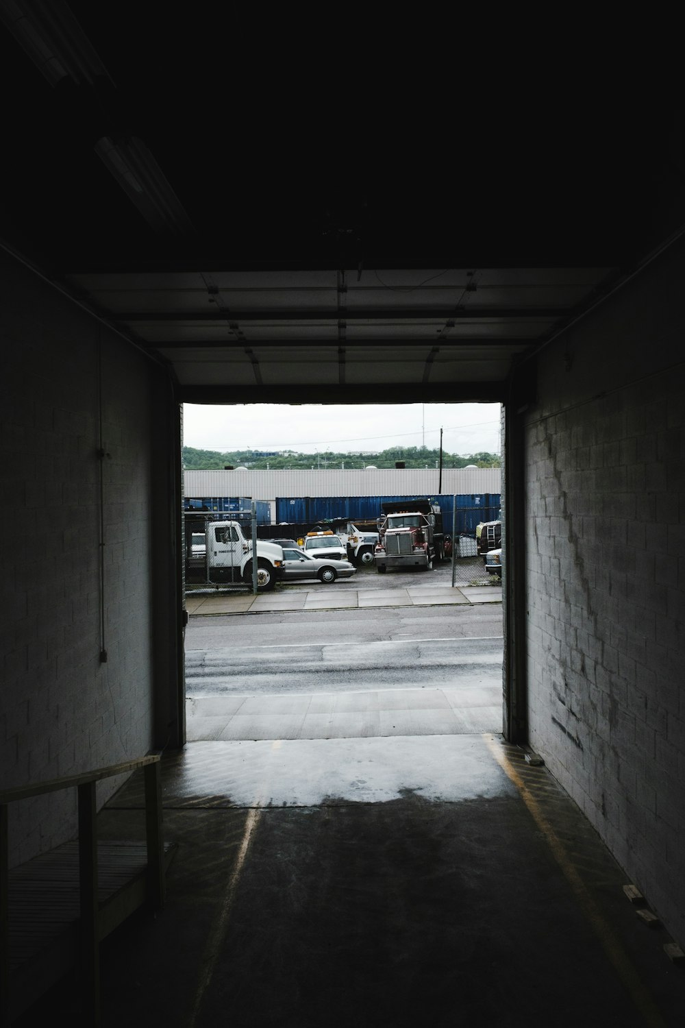 assorted-color vehicle parked beside building during daytime