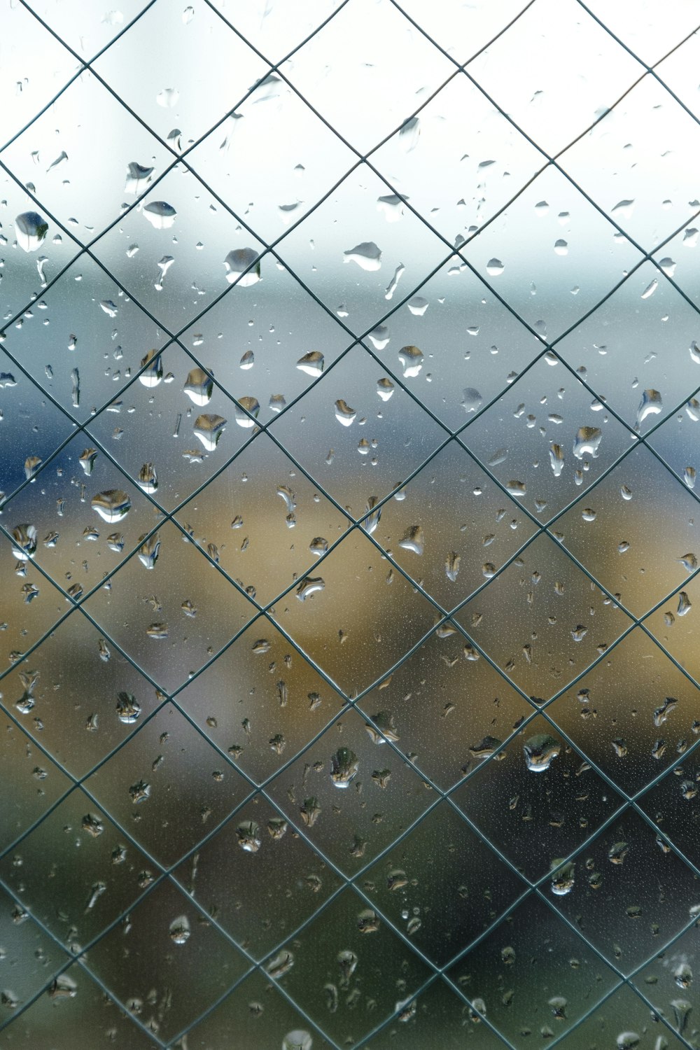 cyclone fence with glass and water moist