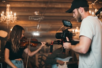 person holding black video camera