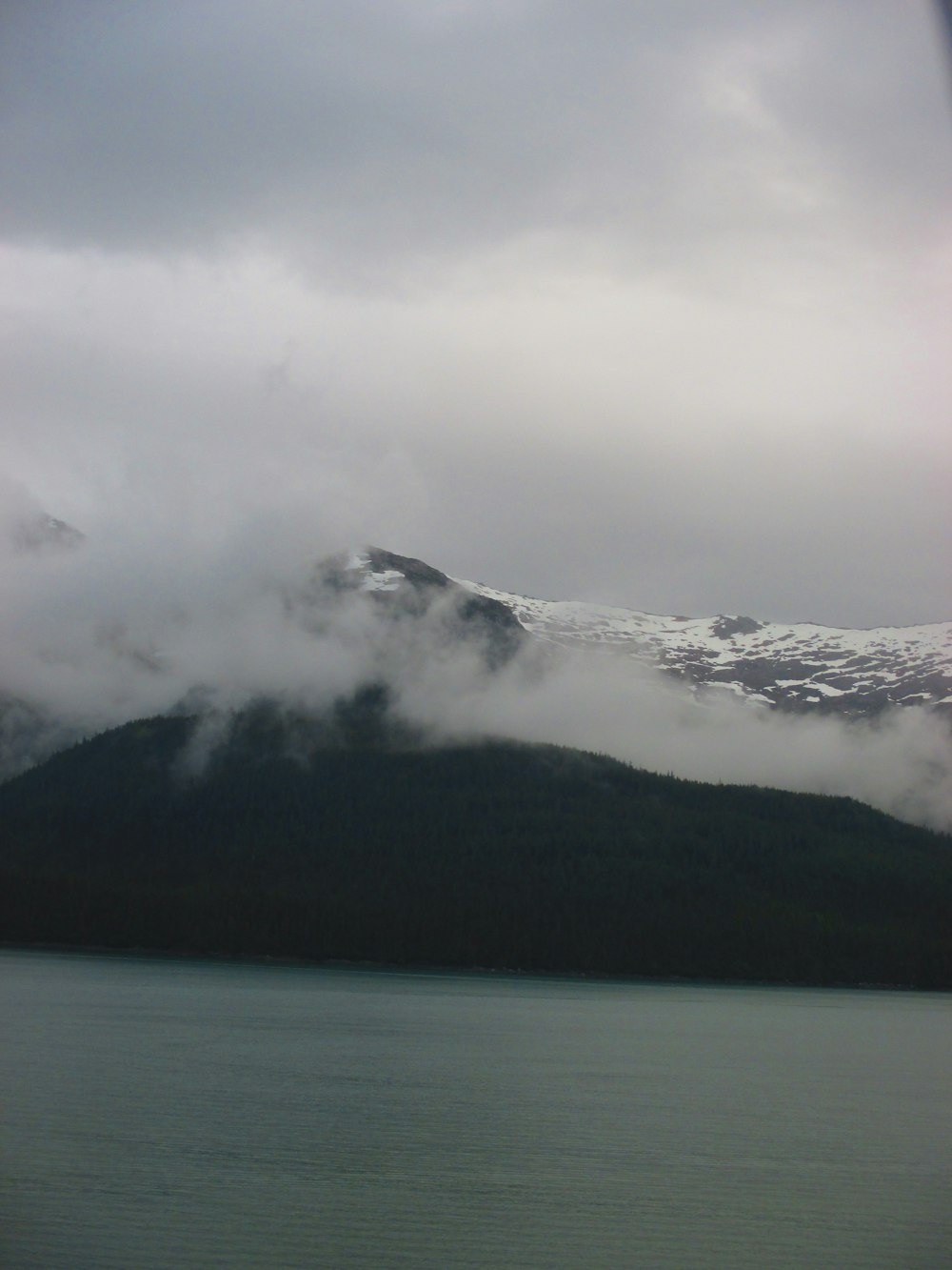 photography of snow-capped mountain under cloudy sky during daytime