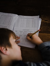 toddler writing indoors