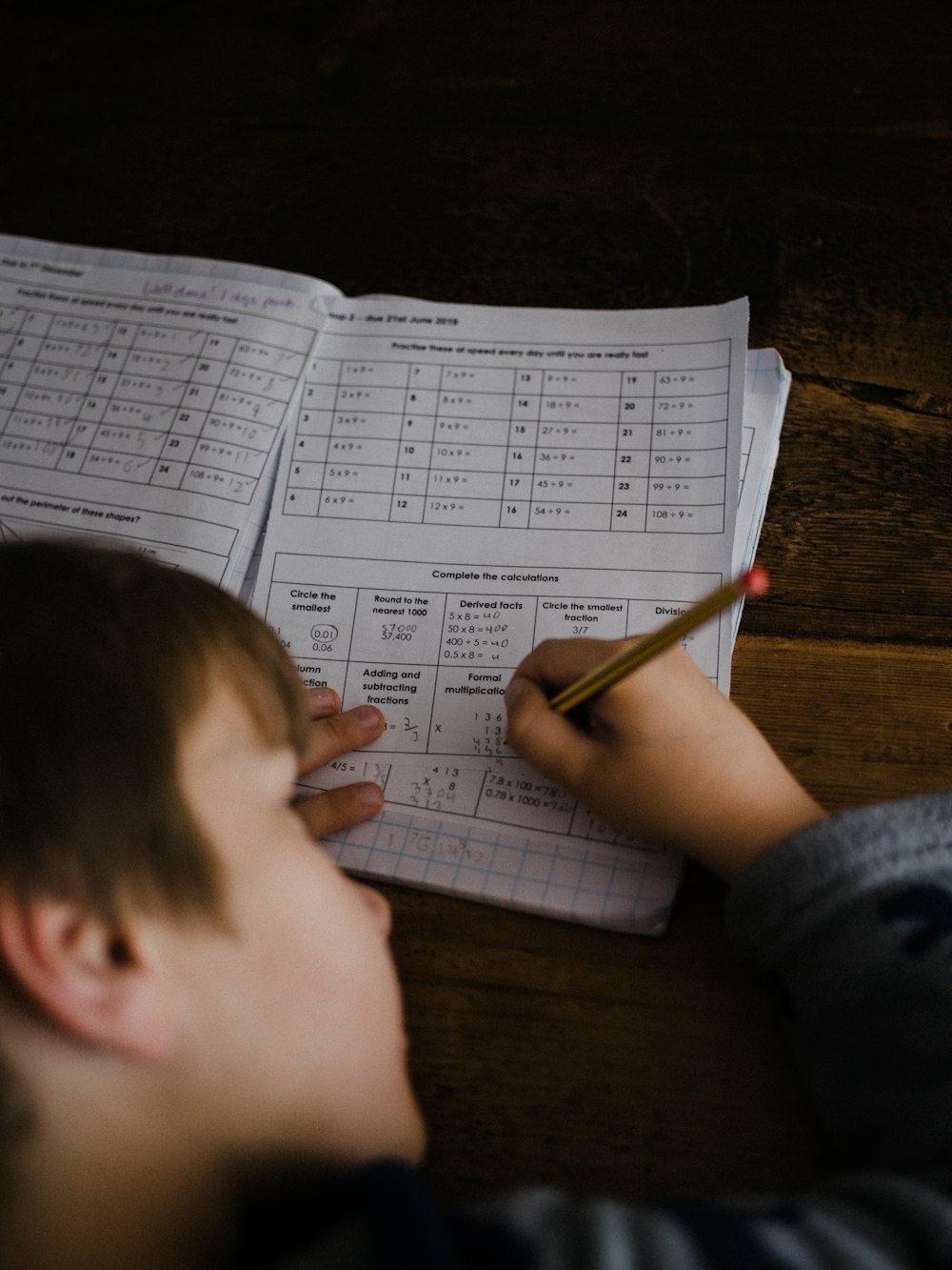 toddler writing indoors