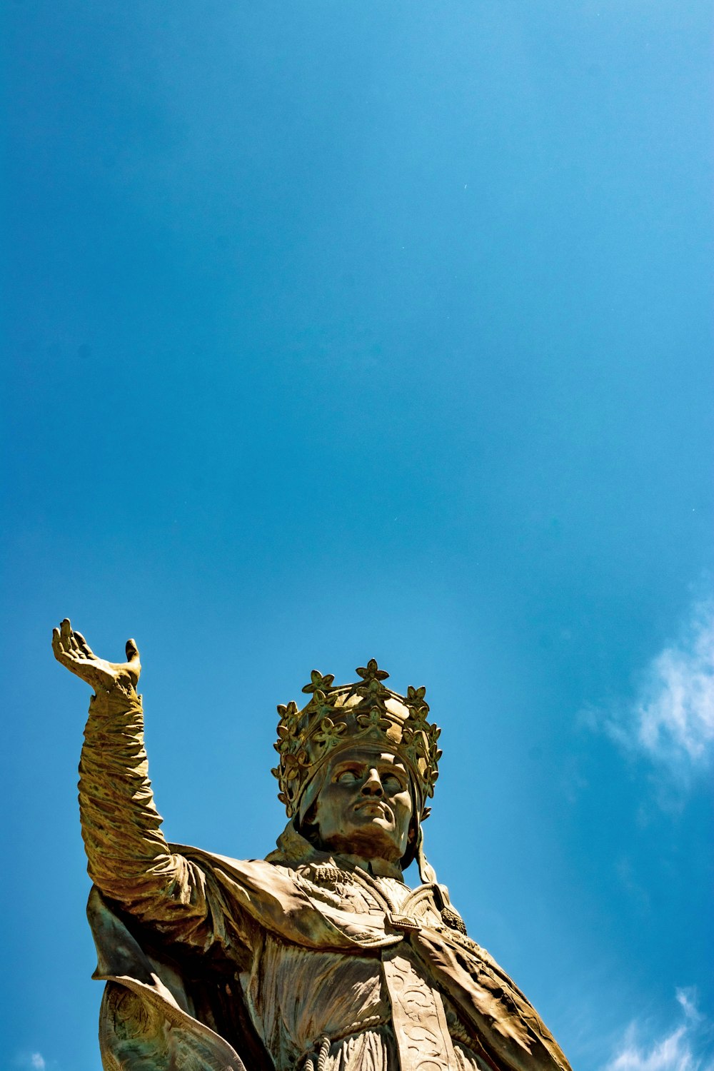 low angle view of king statue under clear blue sky