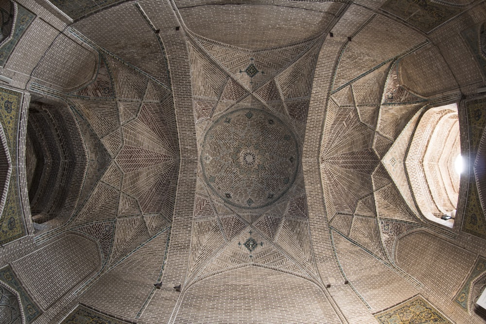 architectural photography of brown monument ceiling