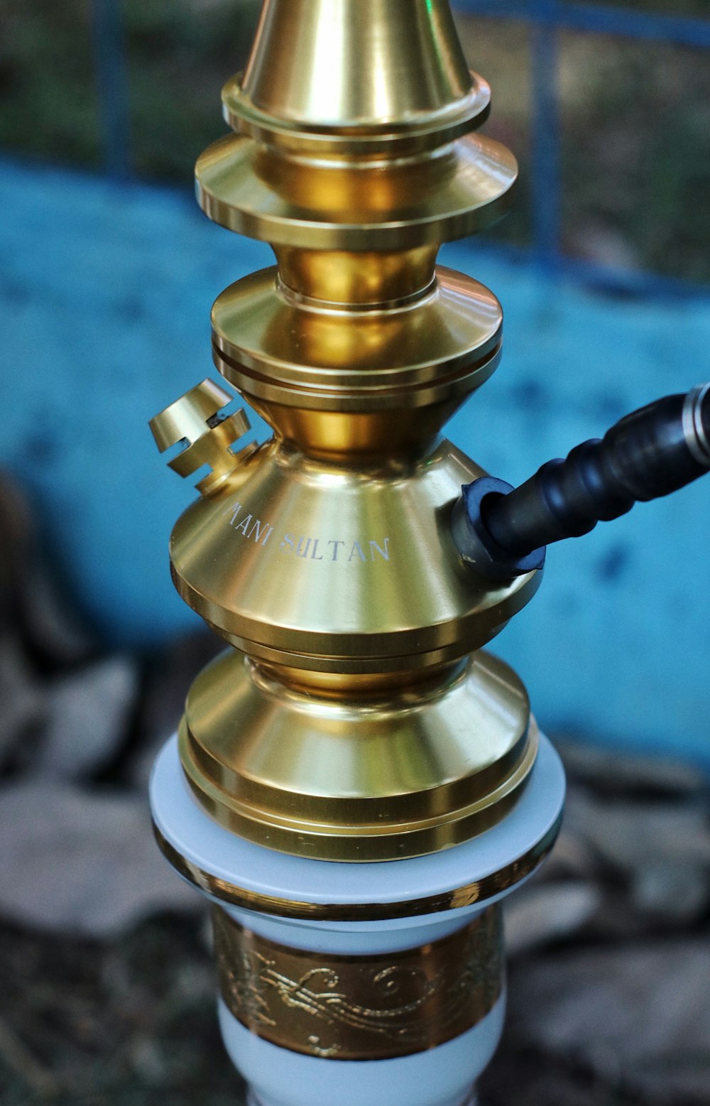 brass-colored and white hookah
