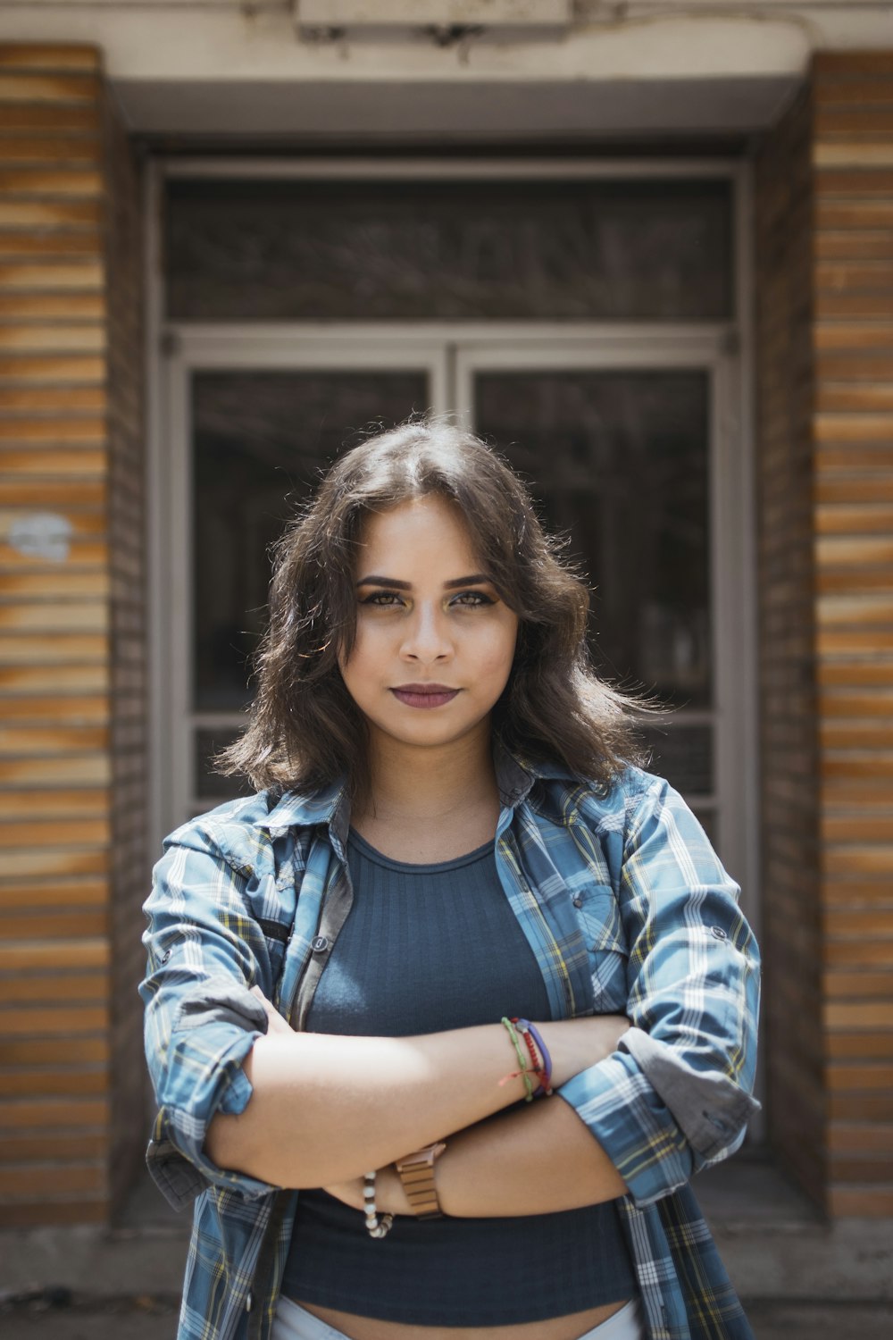 woman standing in front of house