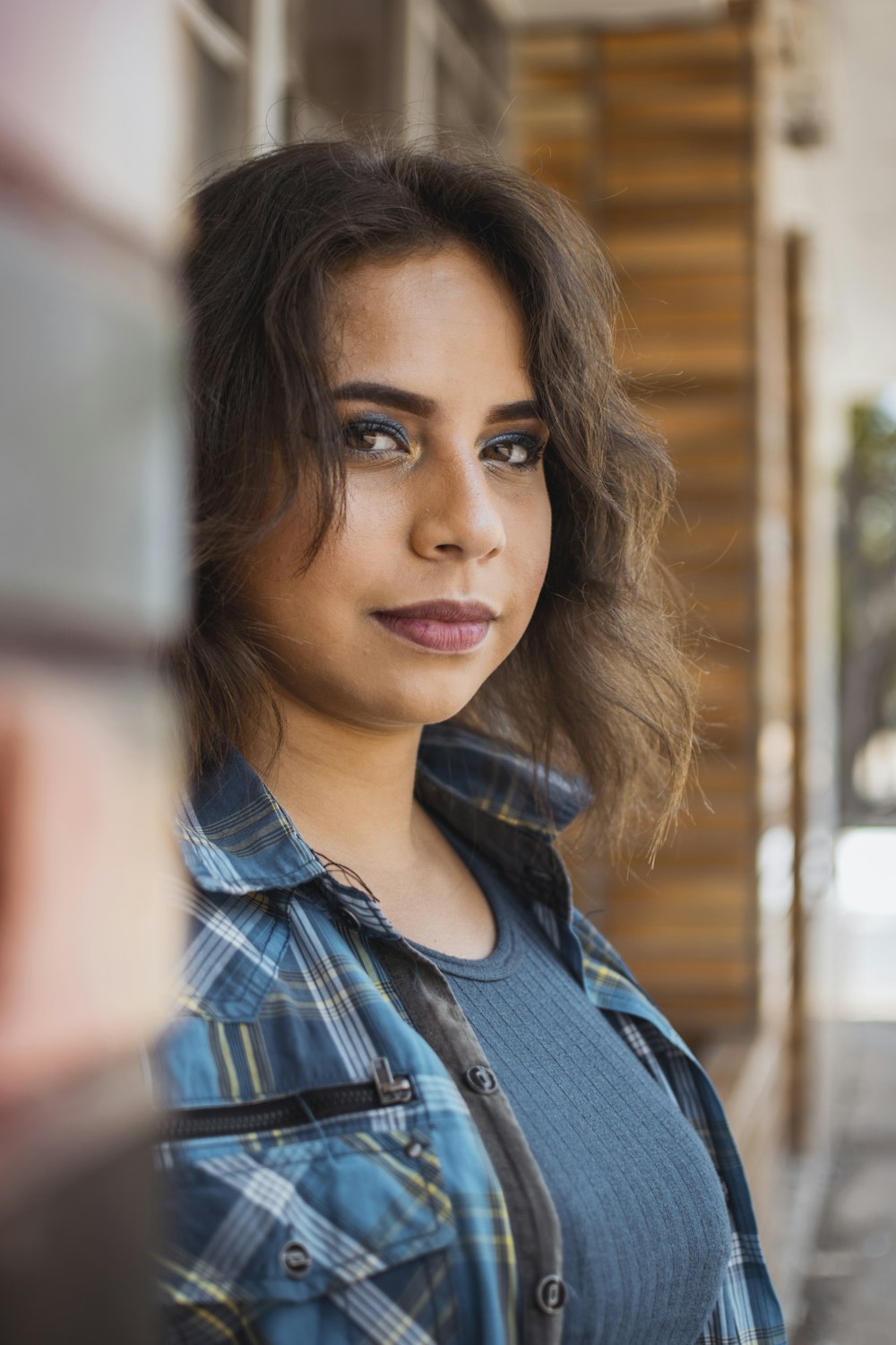 woman wearing blue and gray plaid sport shirt