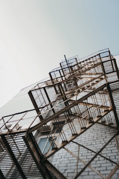 grey metal fire escape stairs at the side of building