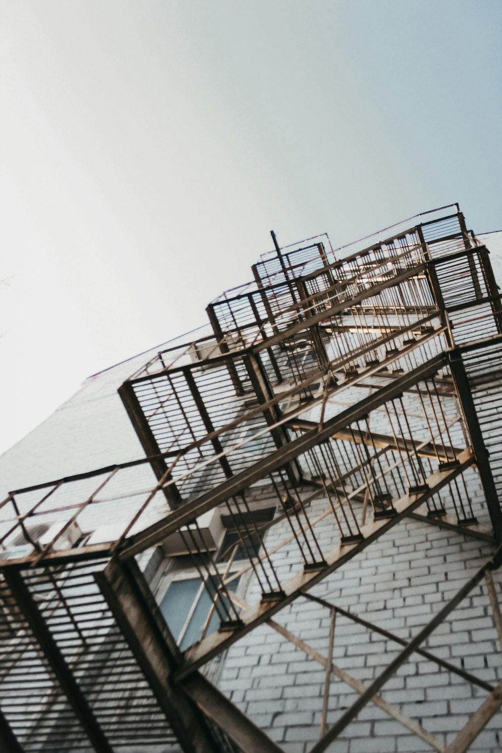 grey metal fire escape stairs at the side of building