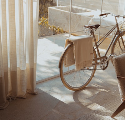 white bike near glass wall