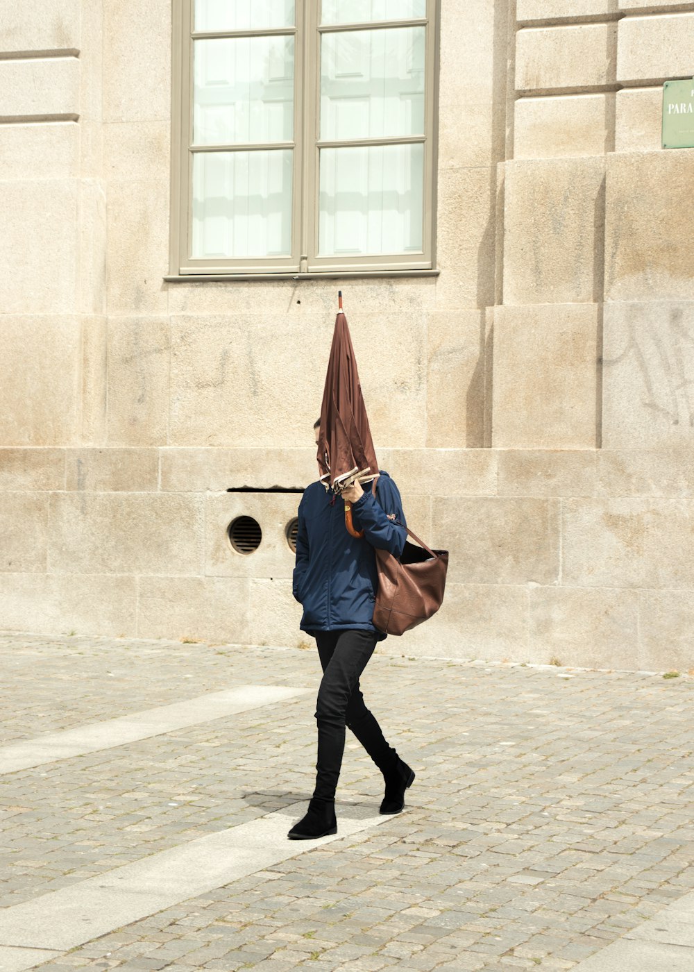 man holding brown umbrella