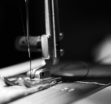 sewing machine grey-scale photography and close-up photography