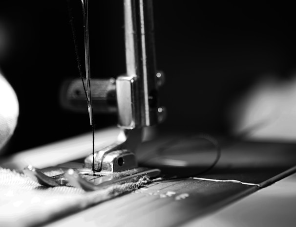 sewing machine grey-scale photography and close-up photography