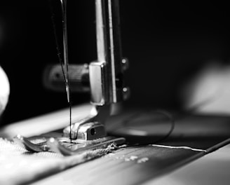 sewing machine grey-scale photography and close-up photography