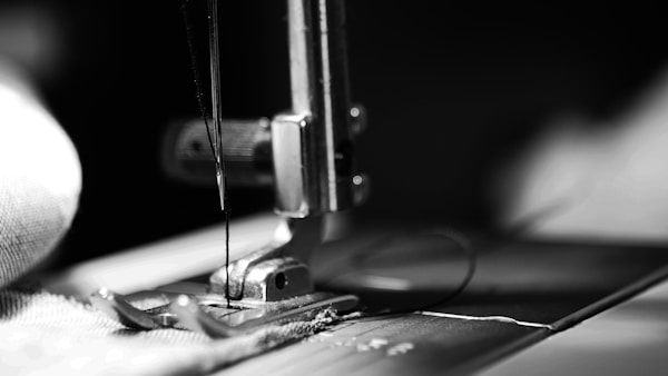sewing machine grey-scale photography and close-up photography