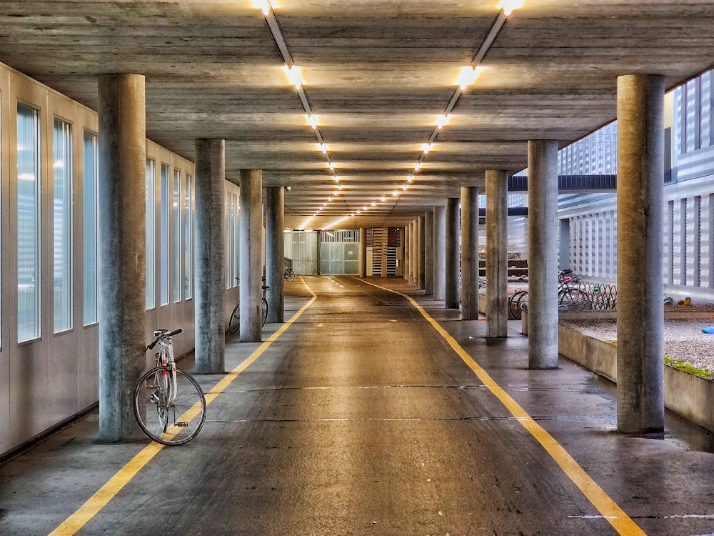 bike in a black road during daytime with lights