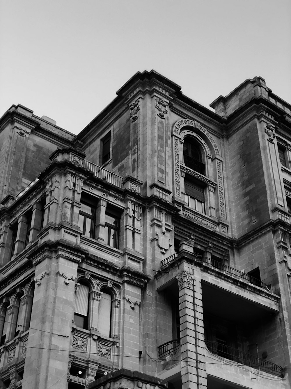 grayscale photo of high rise building