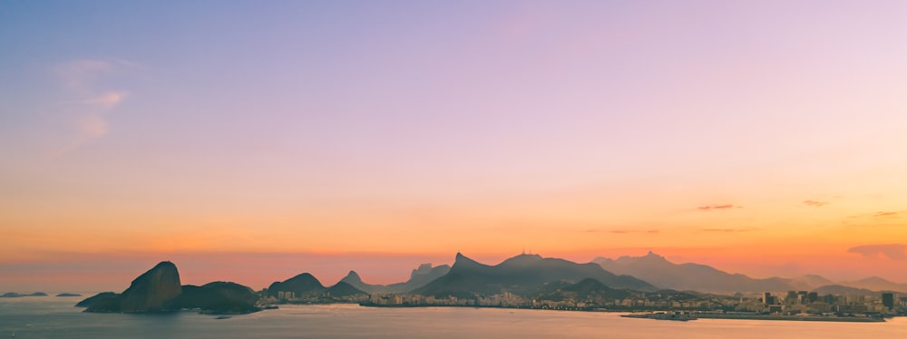 silhouette photo of city during golden hour