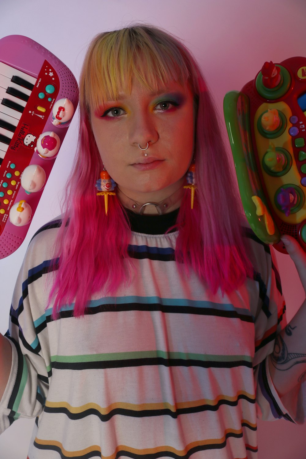 person holding two assorted-color toy close-up photography