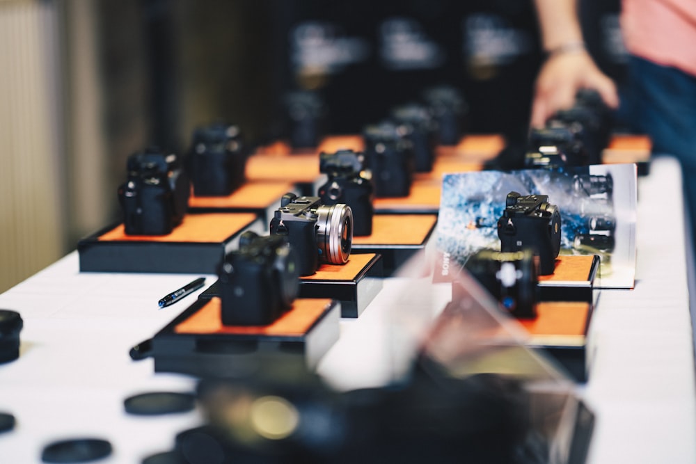 pile of cameras on the table