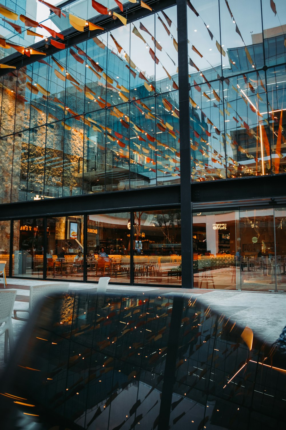 a reflection of a building in a glass window