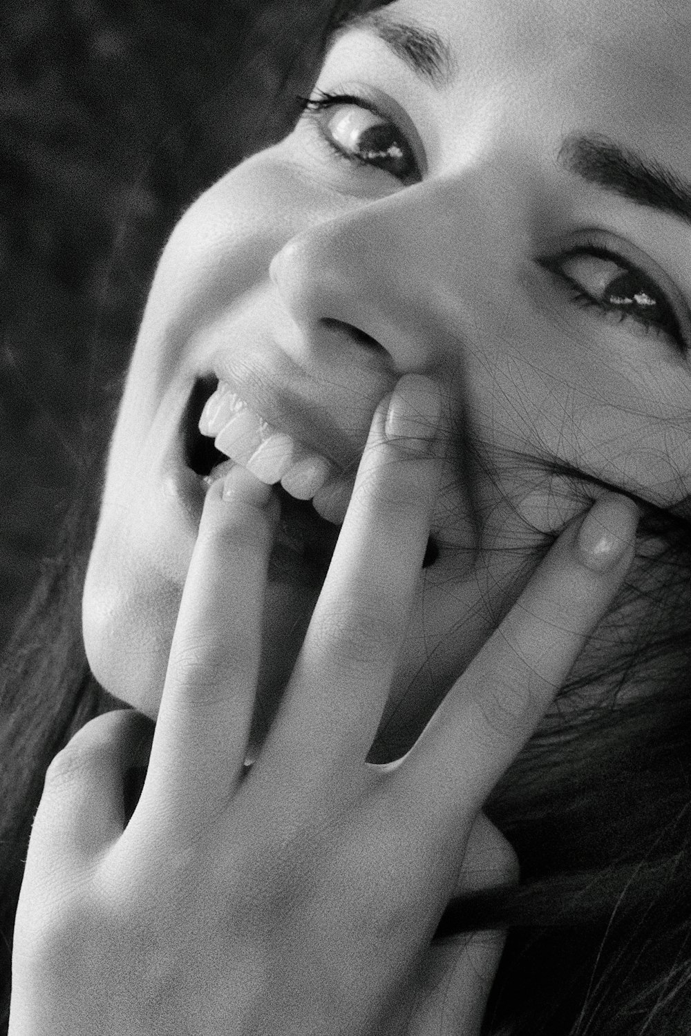 grayscale photo of smiling woman