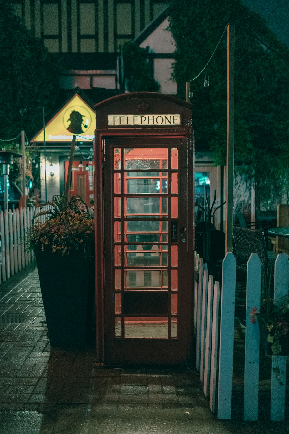 brown Telephone booth in lighted park